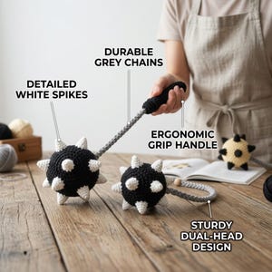 May include: A dual-head flail toy crafted from black and white yarn, featuring two spherical heads with white spikes, connected by grey crocheted chains to a black ergonomic grip handle. Text labels include DETAILED WHITE SPIKES, DURABLE GREY CHAINS, ERGONOMIC GRIP HANDLE, and STURDY DUAL-HEAD DESIGN.