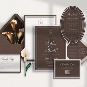 May include: A wedding stationery set in dark brown and white, featuring an envelope with a calla lily print, rectangular and oval cards with elegant typography, a QR code, and a die-cut calla lily accent piece with the text Sophia & Daniel.
