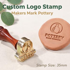 May include: A custom logo stamp with a dark wood handle and a brass head featuring the text POTTERY CLAIRE THOMPSON. Next to it is a circular piece of clay impressed with the same logo. The text Stamp Size: 35mm is visible in the corner.