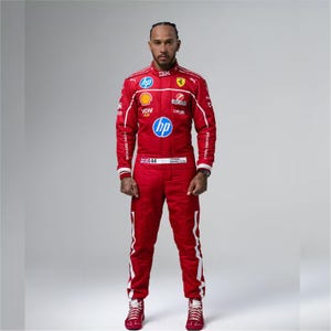 May include: A red racing suit with white accents and sponsor logos, including "HP" and "Richard Mille." The suit features the number "44" and the name "Lewis Hamilton." The racing suit is paired with matching red sneakers.