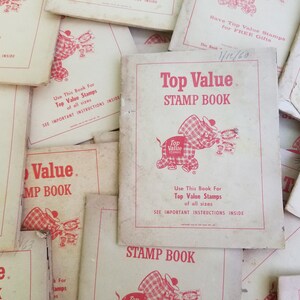 May include: A collection of vintage "Top Value Stamp Book" booklets. The covers are off-white with red text and a cartoon elephant logo. The text reads "Top Value Stamp Book" and "Use This Book For Top Value Stamps of all sizes."