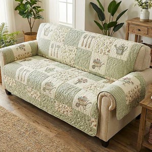 May include: A patchwork sofa cover with a garden theme. The cover features green gingham and floral patterns. Decorative elements include watering cans, wheelbarrows, and gardening tools. The cover is designed to fit over the sofa's cushions and armrests.