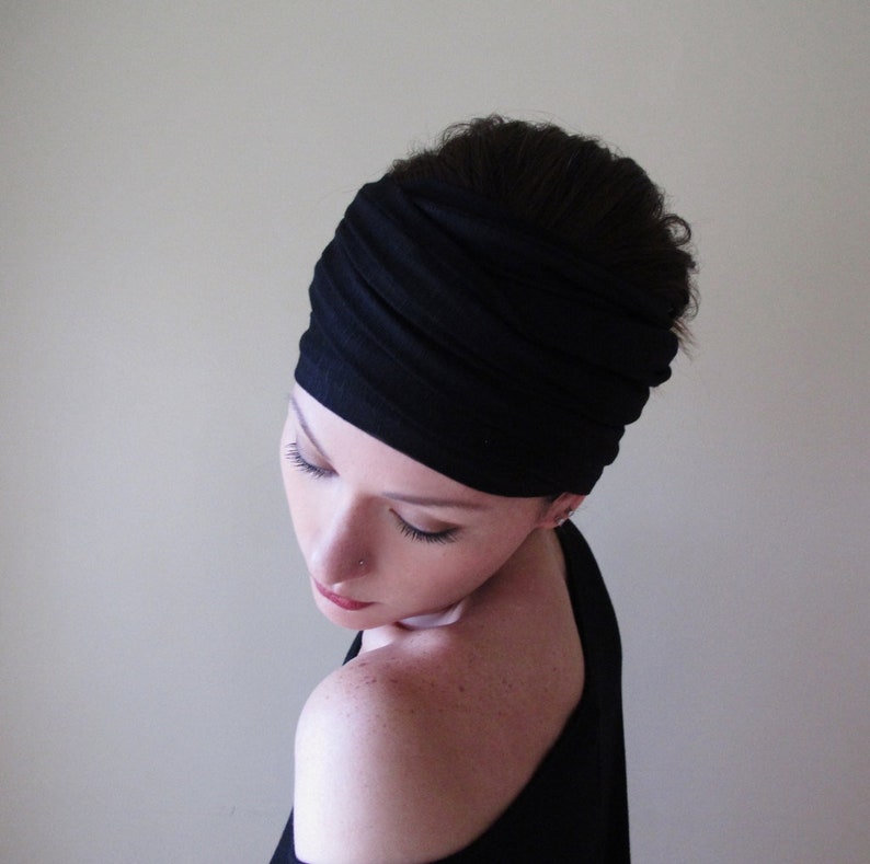 a handmade, black jersey knit headscarf by the brand ecoshag
