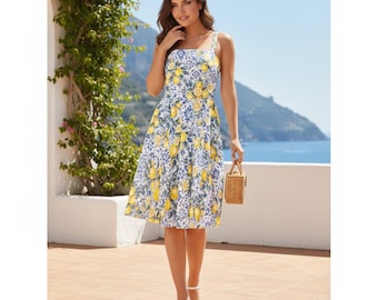 May include: A sleeveless, knee-length dress with a lemon print. The dress features a white background with yellow lemons and blue floral accents. The straps are white, and the dress is worn with white sandals. A small woven basket is held in the hand.