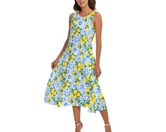 May include: A sleeveless midi dress featuring a vibrant lemon and tile print. The dress showcases a white background with blue tile patterns and yellow lemons. The dress has a flowing skirt and is suitable for warm weather.