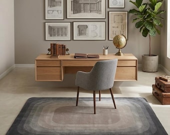 Alfombra moderna con degradado concéntrico en gris y beige.