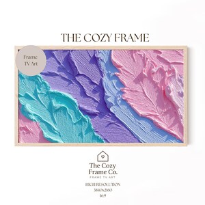 May include: A framed abstract art piece with a textured, colorful design. The artwork features a palette of turquoise, lavender, light blue, and pink. The frame is a light wood color, and the text "THE COZY FRAME" is at the top.