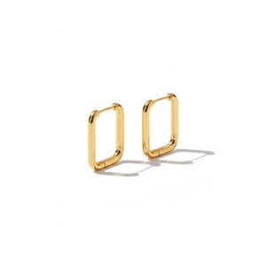 May include: A pair of gold-coloured, rectangular hoop earrings. The earrings have a smooth, polished finish and a simple, modern design. The earrings are shown on a white background.