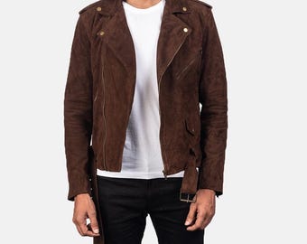 May include: A brown suede biker jacket with a classic asymmetrical zip closure, featuring a notched lapel, shoulder epaulets, and a belt at the waist. The jacket has a soft, textured appearance and is accented with gold-tone hardware.