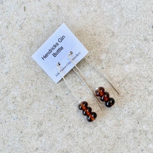 Long brown recycled glass earrings. Beads made from a Hendrick's gin bottle. Sustainable, statement earrings, sterling silver