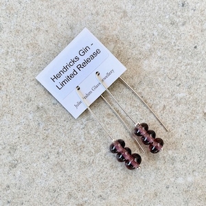 Long recycled glass earrings. Purple beads made from a gin bottle. Sustainable, statement earrings, sterling silver