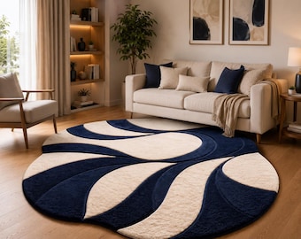 Rond getuft vloerkleed in marineblauw en crème,