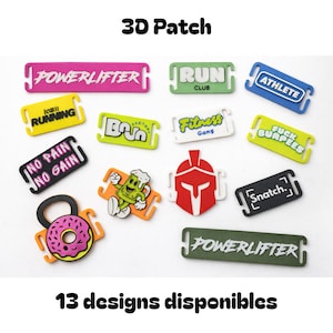 Peut inclure: Divers patchs 3D colorés avec des inscriptions sportives. Les patchs affichent des phrases telles que « POWERLIFTER », « RUN CLUB » et « ATHLETE ». D'autres motifs incluent un personnage de dessin animé et un donut d'haltérophilie. Le texte « 3D Patch » et « 13 designs disponibles » sont également visibles.