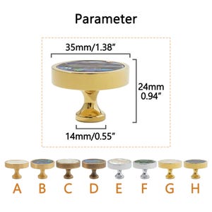 May include: A gold cabinet knob with a round, iridescent top, measuring 35mm in diameter and 24mm high. The knob has a decorative design and is 14mm in diameter at the base. The word "Parameter" is at the top.