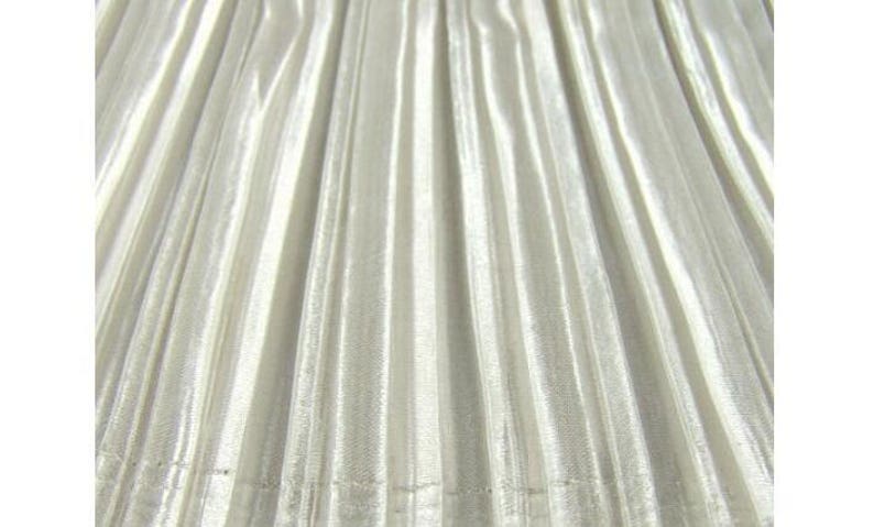May include: A close-up of a white pleated fabric with a subtle shimmer. The fabric has a smooth, silky texture.