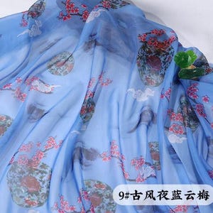 May include: Light blue fabric with a floral pattern featuring red flowers and green accents. The fabric has a semi-transparent quality, with a design that includes circular motifs and cloud-like shapes. Text in the lower right corner reads "9# ancient style blue cloud plum".