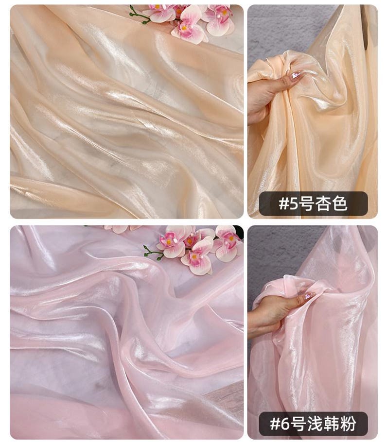 May include: Close-up of two sections of sheer fabric in peach and light pink. The peach fabric has the text "#5" and Chinese characters. The pink fabric has the text "#6" and Chinese characters. Artificial flowers are placed on top of the fabric.