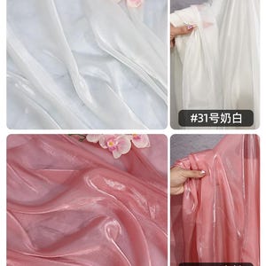 May include: Close-up of two types of sheer fabric. One is a bright white, and the other is a soft pink. Both fabrics are draped and have a slight sheen. The white fabric has the text "#31" and Chinese characters. The pink fabric has the text "#32" and Chinese characters.