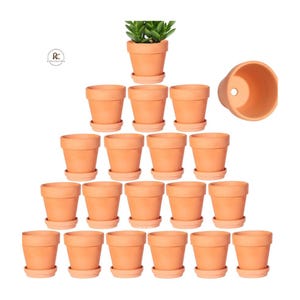 May include: A collection of terracotta-colored plant pots, each with a matching saucer. One pot is filled with a green plant. The pots are arranged in a pyramid shape, with one pot at the top and increasing rows below.
