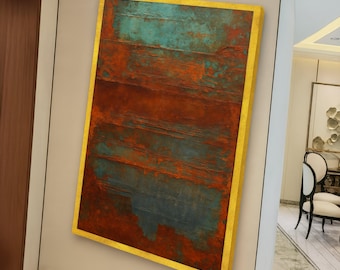 May include: Abstract wall art with a gold frame. The artwork features a textured surface with horizontal bands of teal and rust-colored hues. The piece is mounted on a neutral-colored wall, adding a touch of modern decor.