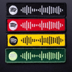 May include: Four rectangular patches in black, red, yellow, and green. Each patch features a white Spotify logo in the upper left corner and a white soundwave design. The patches are likely for clothing or accessories.