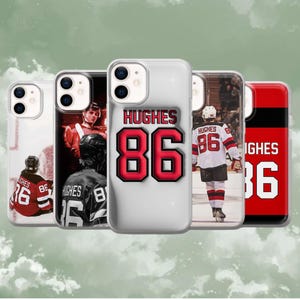 May include: A collection of phone cases featuring hockey player Hughes and the number 86. The cases display images of the player in action, along with his name and number in bold, red and black designs.
