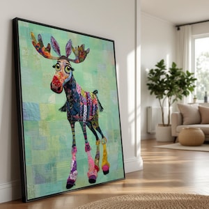May include: A framed art print of a whimsical moose with a colorful patchwork design. The moose has large eyes, a red nose, and vibrant antlers. The background is a light green, quilted pattern.