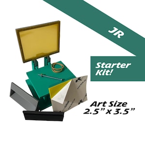 May include: A screen printing starter kit with a yellow screen, green base, and various tools. Includes a rubber band, bolt, and a piece of paper with the text "printGRIP". The art size is 6.35cm x 8.89cm.