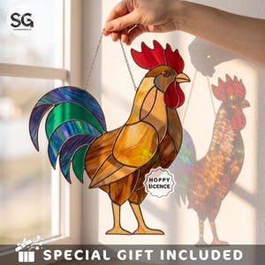 May include: A stained glass rooster suncatcher featuring a vibrant red comb and wattle, a golden-brown body, and a tail with iridescent blue and green glass segments. The piece includes a small white label with the text HOPPY LICENCE.