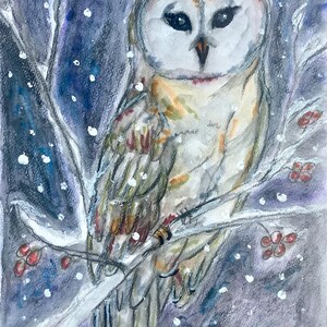 May include: Watercolor painting of a barn owl perched on a snow-covered branch. The owl has a white heart-shaped face, dark eyes, and a mix of brown and white feathers. Red berries and falling snow complete the winter scene.
