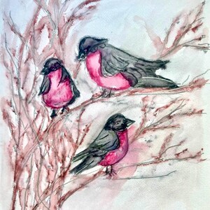 May include: Watercolor painting of three birds perched on branches. The birds have black heads and wings, with pink chests and bellies. The branches are a reddish-brown color, and the background is a soft white. Signed "Linda 12-2023".