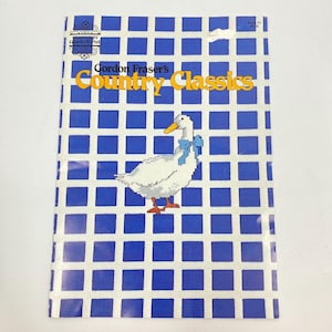 May include: A set of three ceramic mugs with a speckled, matte finish. The mugs are in shades of cream, light gray, and dark gray. Each mug has a simple, minimalist design, perfect for coffee or tea.