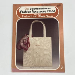 May include: A vintage Columbia-Minerva Fashion Accessory Ideas craft booklet featuring a white plastic canvas tote bag with a geometric pattern, a maroon patterned scarf, and a red beaded necklace. The cover includes the text FashionEase.