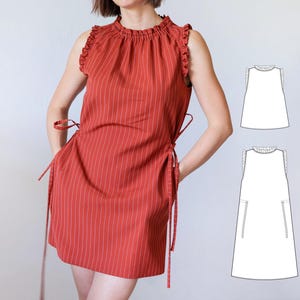 May include: A sleeveless, rust-colored dress featuring thin white vertical pinstripes, a ruffled high neckline, and side ties at the waist. The design includes a straight silhouette and is accompanied by two white line-art technical sketches.