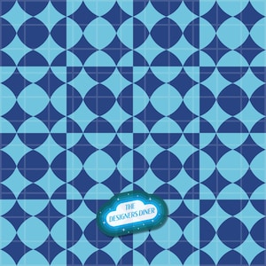 May include: A repeating geometric pattern featuring alternating dark blue and light blue circles and squares. A small, cloud-shaped blue emblem is positioned in the lower center, containing the white text "THE DESIGNERS DINER".