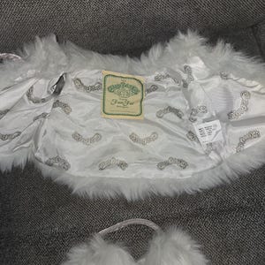 May include: A set of three ceramic mugs with a speckled, matte finish. Each mug features a different color: light blue, cream, and gray. The mugs have a simple, modern design and a comfortable handle.