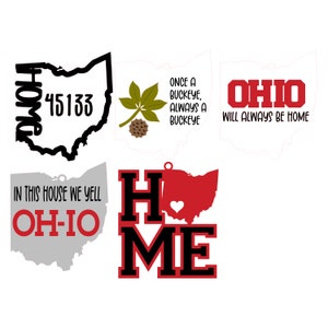 May include: Four different designs featuring the state of Ohio. The first design is a black outline of the state with the words "Home" and "45133" inside. The second design is a green buckeye leaf with a brown buckeye nut. The third design is a white outline of the state with the words "Ohio Will Always Be Home" in red. The fourth design is a red outline of the state with a heart in the centre and the words "Home" in black.