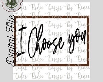 May include: A digital file for a printable design that says "I Choose You" in a black cursive font inside a brown frame. The background is white with a repeating pattern of "Cedar Ridge Design By Renee".