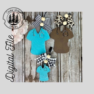 May include: Three wooden nurse scrubs with stethoscope designs, each with a different bow attached. The bows are black and white checked, leopard print, and black and white polka dot. The scrubs are teal, brown, and teal.