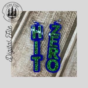 May include: A pair of blue and green glitter earrings with the words "HITO" and "ZERO" on them.