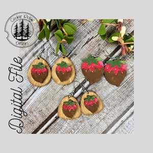 May include: Four pairs of wooden earrings shaped like strawberries dipped in chocolate. The earrings are painted red, brown, and green.