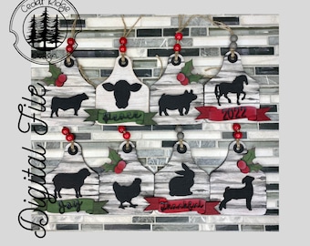 May include: Eight wooden ornaments shaped like livestock tags with various farm animals, including a cow, pig, horse, sheep, chicken, rabbit, and a lamb. Each ornament has a different word or phrase on it, including "Peace", "Joy", "Thankful", and "2022".