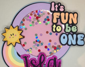 It’s fun to be one cake topper