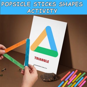May include: A colorful educational activity featuring popsicle sticks and a printed triangle shape. The image shows a triangle made of orange, green, and blue popsicle sticks, mirroring a printed triangle. The text "POPSICLE STICKS SHAPES ACTIVITY" is at the top.
