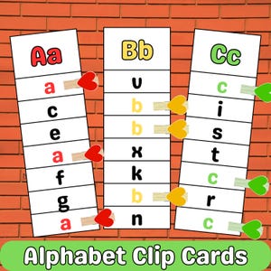 May include: Three alphabet clip cards with the letters Aa, Bb, and Cc. Each card has a series of letters, with the uppercase letter at the top. The cards are attached with heart-shaped clothespins. The words "Alphabet Clip Cards" are at the bottom.