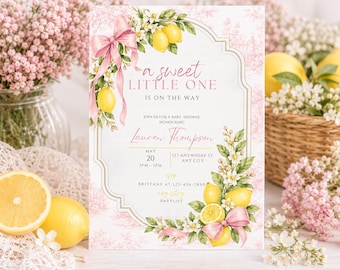 May include: A rectangular baby shower invitation card featuring a pink toile background, yellow lemon illustrations, green leaves, and pink ribbons. The text reads: A sweet little one is on the way, join us for a baby shower honouring Lauren Thompson.