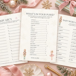 Könnte beinhalten: Drei weiße Spielkarten aus Papier für eine Babyparty mit Nussknacker- und Ballerina-Motiv. Die Karten tragen die Titel Baby ABC's, What's In Your Purse und Baby Word Scramble und enthalten Listen mit Gegenständen sowie Worträtsel in schwarzer Schrift.