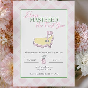 May include: A pink and green invitation with the text "Eloise MASTERED Her First Year". The invitation features a golf-themed graphic with a map of the United States and a golf flag. The invitation also includes the date, time, and RSVP information.