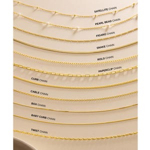 May include: An array of gold-coloured necklaces, each showcasing a different chain design. Styles include Satellite, Pearl Bead, Figaro, Snake, Rolo, Paperclip, Curb, Cable, Box, Baby Curb, and Twist chains. The chain styles are labelled above each necklace.