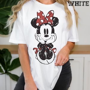 May include: A set of three ceramic mugs with a speckled, matte finish. The mugs are in shades of cream, light gray, and dark gray. Each mug has a simple, minimalist design, perfect for coffee or tea.